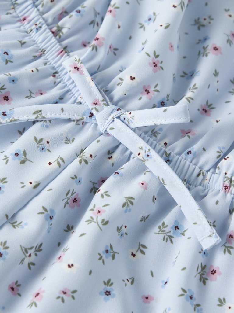 Byxdress Vinaya Blommor Blå